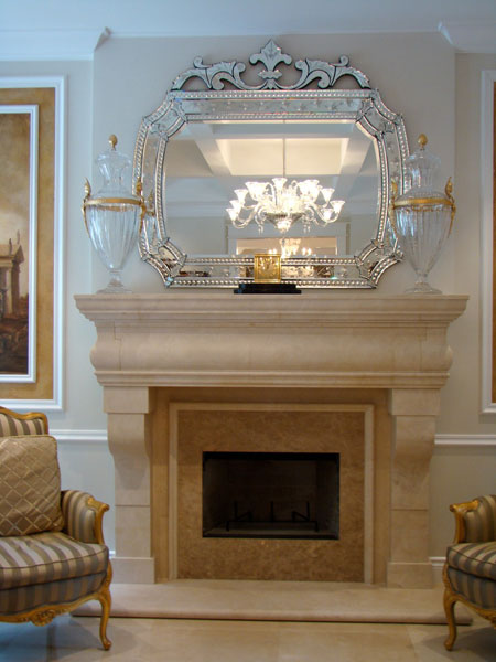 Traditional simple fireplace with venetian mirror