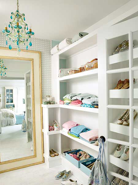 White closet with blue chandelier